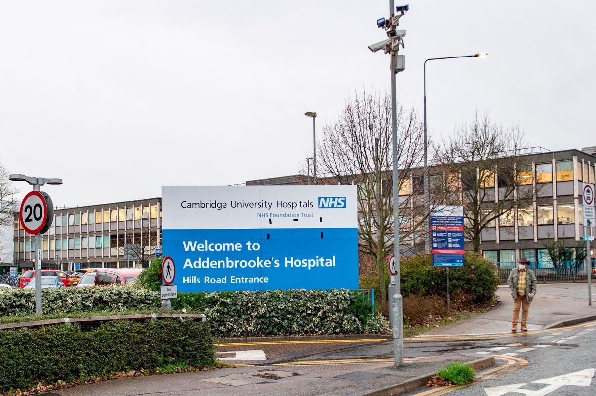 Addenbrooke's Hospital sign in front of hospital building.
