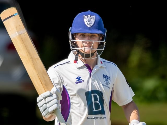 Archie Houghton acknowledges the balcony after reaching a half-century against Norfolk in August 2025