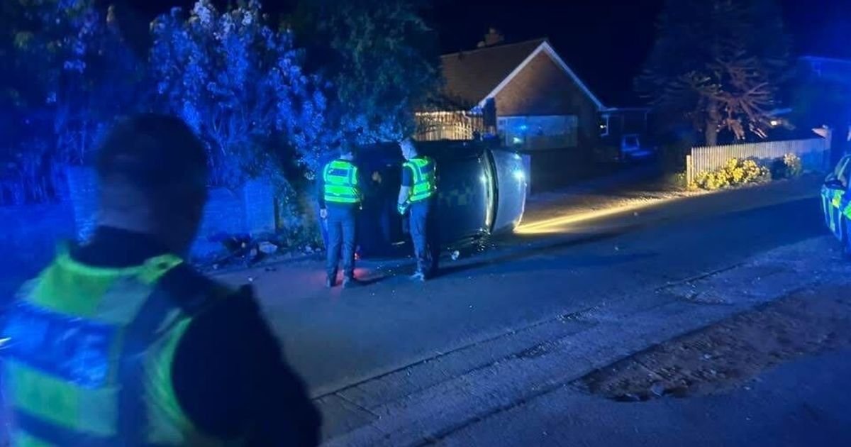 Four arrested after crash leaves car on side on Cambridgeshire road