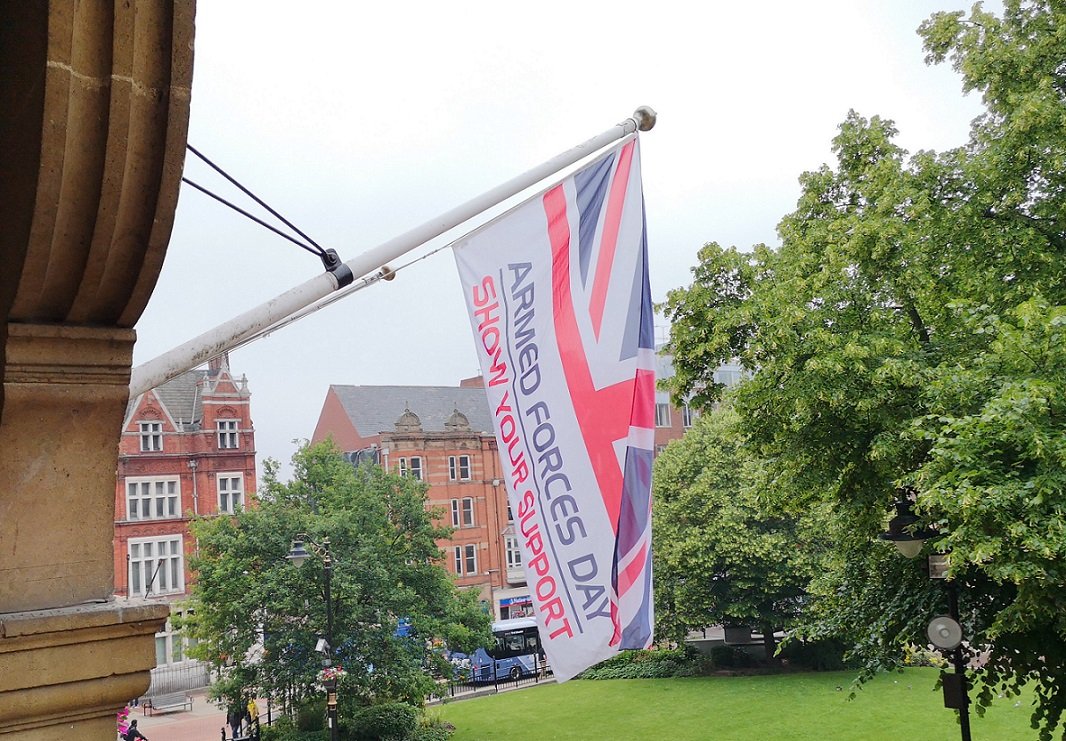 Flag-raising marks start of Armed Forces Week